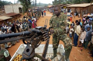 A file photograph shows an armed soldier from Congo's UPC rebel group standing guard at Barriere village